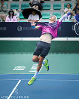 Térence Atmane executing a perfect overhead smash